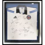 A framed and glazed Bath Rugby shirt from the 2000
