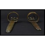 A pair of antique brass and steal bladed African a