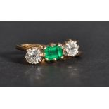 An 18ct gold diamond and emerald ring having appro