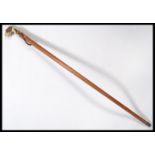 A vintage 20th century walking stick cane having a