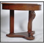 A Victorian mahogany Duchess console table being r