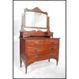 An Edwardian mahogany dressing table chest being r