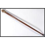 A vintage 20th century walking stick cane having a