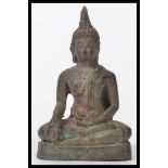 A Tibetan bronze buddha, 20th century, seated in t