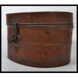 A 19th century Victorian tin hat box having a hing