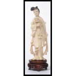 A Japanese ivory Okimono of a bijin, Meiji period,