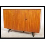 A 1970's retro teak wood metamorphic sideboard des
