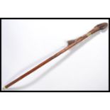 A vintage 20th century walking stick cane having a