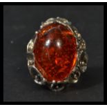 A sterling silver and substantial amber cabochon r