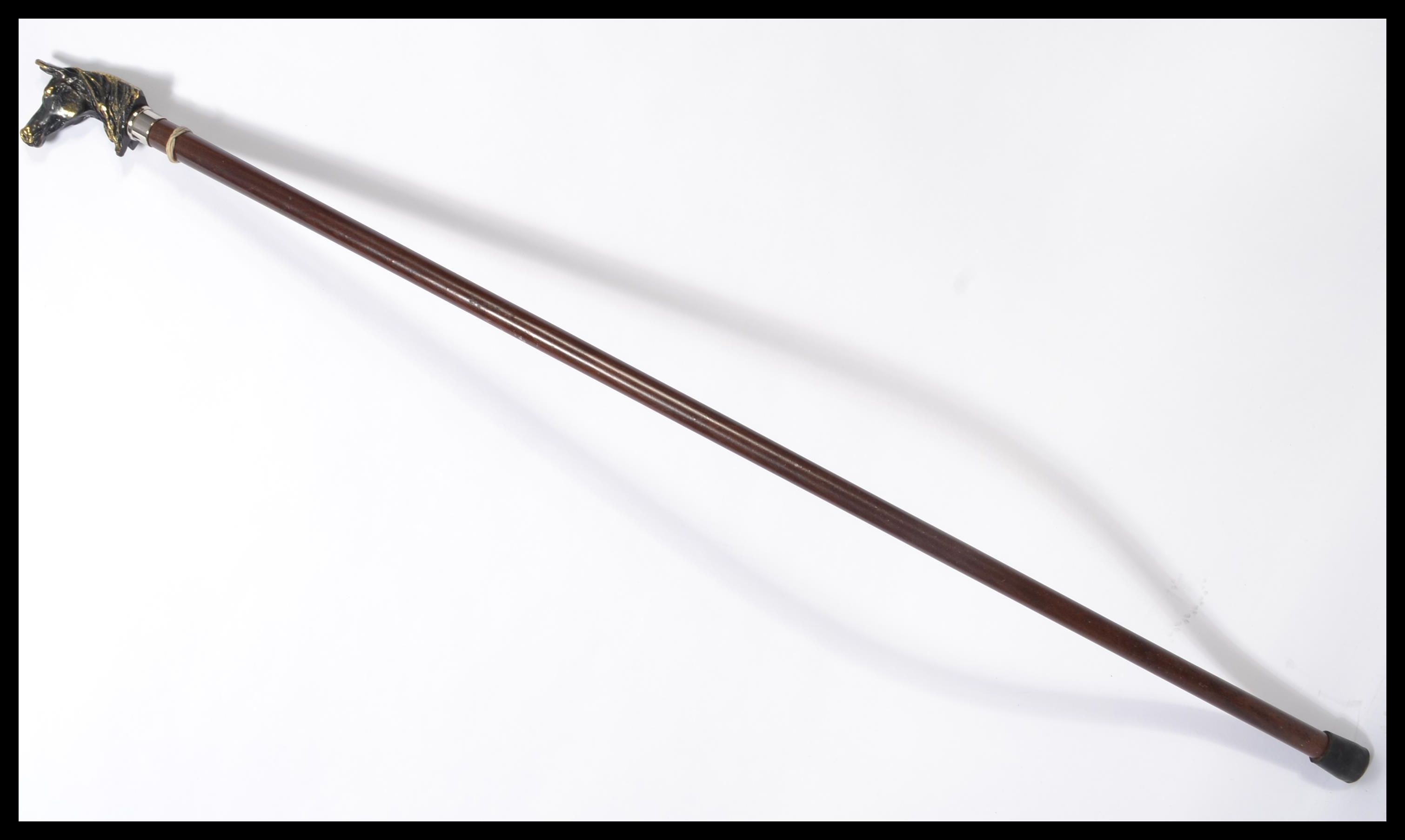 A vintage 20th century walking stick cane having a