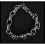 A sterling silver interlocking bracelet having pan