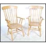 A pair of antique style beech wood Windsor style l