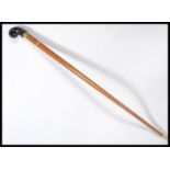 A vintage 20th century walking stick cane having a