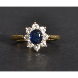 An 18ct gold diamond and sapphire ring having a ce