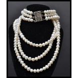 A three row freshwater pearl strand pearl necklace