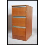 A 1970's retro teak wood 3 drawer upright pedestal