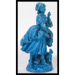 A 19th century Naples figurine group of a lady and