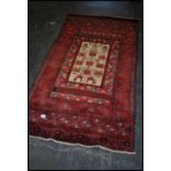 A stunning Persian woolen rug having central beige