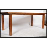 A 20th century hard wood refectory dining table ra