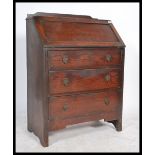 A 20th century oak fall front bureau / desk with f