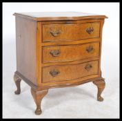 A 20th Century Regency Revival serpentine front bedside chest of drawers consisting of three