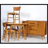 Avalon Yatton - A 1950's retro vintage teak wood dining suite comprising of an extending draw leaf