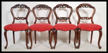 A set of 4 Victorian mahogany balloon back dining chairs. Overstuffed seats with balloon shaped back