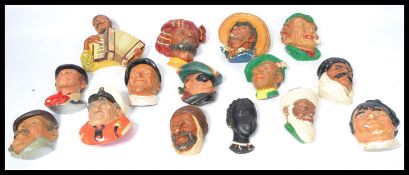 A large collection of vintage mid Century chalk-ware Bossons wall hanging busts fifteen different
