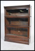 An Edwardian solid oak  3 section /  tier lawyers - barristers stacking bookcase cabinet by  Globe