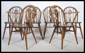 A set of six vintage mid 20th Century Ercol hoop back beech and elm dining chairs to include two