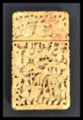 A finely carved Cantonese ivory card case, worked with figures in a continuous scene amongst weaving