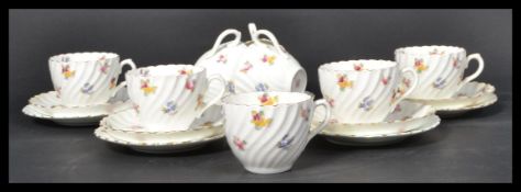 A vintage early 20th Century bone China tea service, hand painted design with makers marks to base.