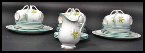 A 19th century tea service hand painted with leave