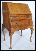 A 1940's walnut Queen Anne revival bombe front ladies writing bureau. The fall front bureau with