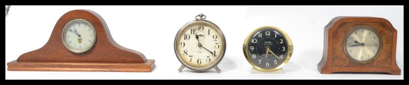 A collection of four vintage 20th Century clocks to include Smiths, a Westclox Big Ben repeater,