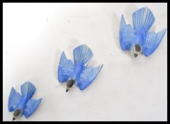 A set of three 1930's Poole Pottery Bluebirds, designed and modelled by John Adams and Harry
