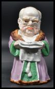 A 19th century Conta & Boehme porcelain tobacco jar & cover of a robed man reading The Times