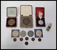 A collection of commemorative medalletes - coins to include Queen Victoria at Bristol Durdham