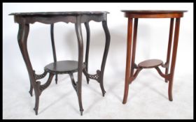 An Edwardian Art Nouveau ebonised centre table having pierced frieze on shaped legs together with an