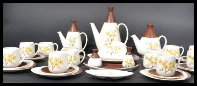 A retro 20th century Carltonware dinner service in a two tone brown and cream white colourway having