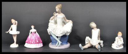 A group of ceramic figurines to include Royal Doul