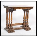 An antique style oak nest of tables in the Jacobean manner. Of solid oak construction with
