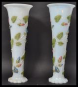 A pair of early 20th century opaque milk glass tru