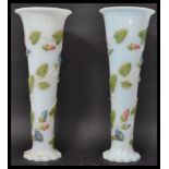 A pair of early 20th century opaque milk glass tru