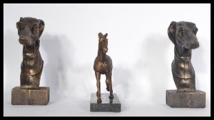 A pair of bronzed effect cast metal greyhound busts together with a bronzed cast metal horse