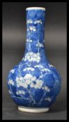 A 19th century Chinese blue and white baluster vas