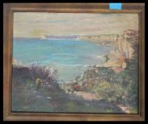 An early 20th century English school oil on board painting of a Devon coastline - cliff scene