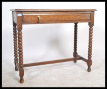 A 19th century Victorian oak hall - console table being raised on bobbin turned legs united by