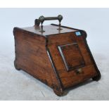 A 19th century oak fireside compendium coal box having carved details with brass handles. Complete