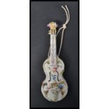 A 19th Century Italian ceramic pottery wall pocket modelled as a Cello, hand decorated with
